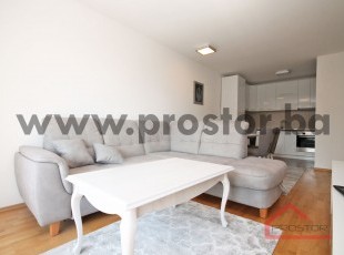 Three bedroom modern apartment with a balcony in a new building, Miljacka