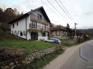 A house with a garage and a large yard on a plot of 5,268sqm with excellent access in a quiet and urban part of the settlement Reljevo