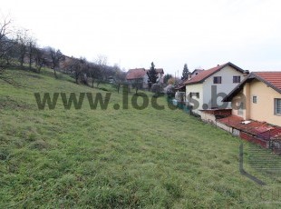 A spacious plot with an open view and communal infrastructure, registered area of ​​2,299m2, only approx. 5 min. drive from the center of Vogošće, Uglješići