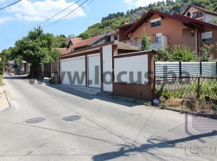 A quality built house with two garages and a landscaped yard with a beautiful view of the city on a plot of 310m2 in the Soukbunar settlement, Centar Municipality